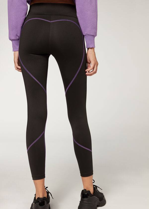 leggings deportivos de alto rendimiento calzedonia con costuras en contraste para mujer color negro y morado