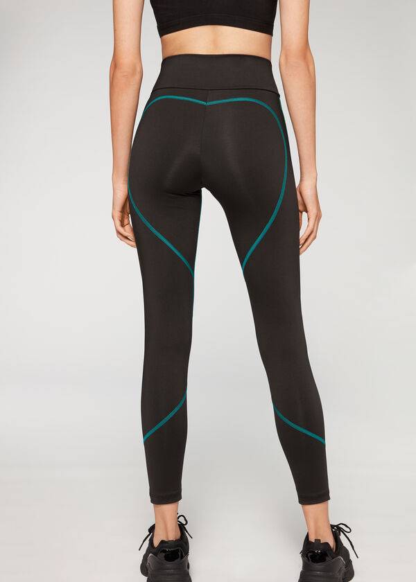 leggings deportivos de alto rendimiento calzedonia con costuras en contraste para mujer color negro y verde