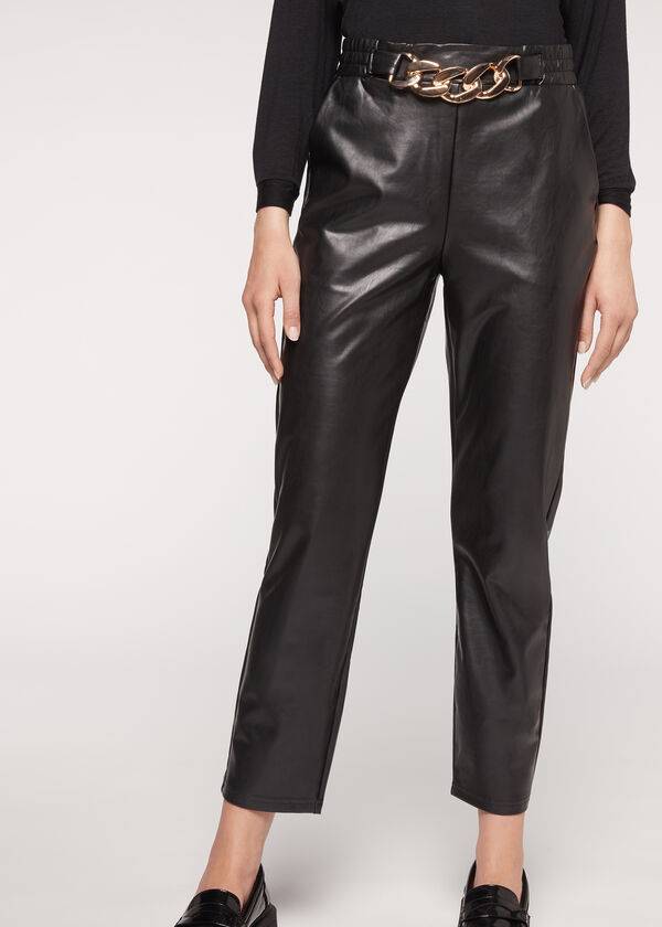 pantalones negros calzedonia con efecto térmico recubierto y ribete de cadena para mujer