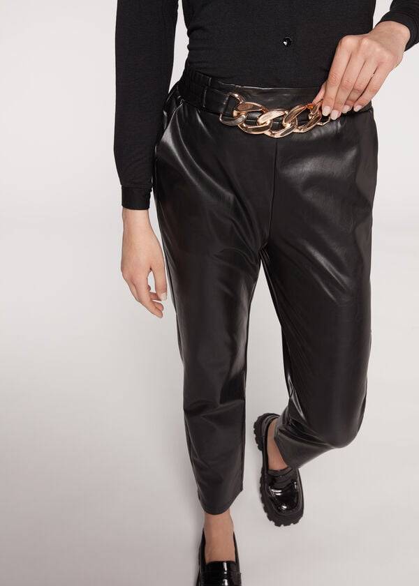 pantalones negros calzedonia con efecto térmico recubierto y ribete de cadena para mujer